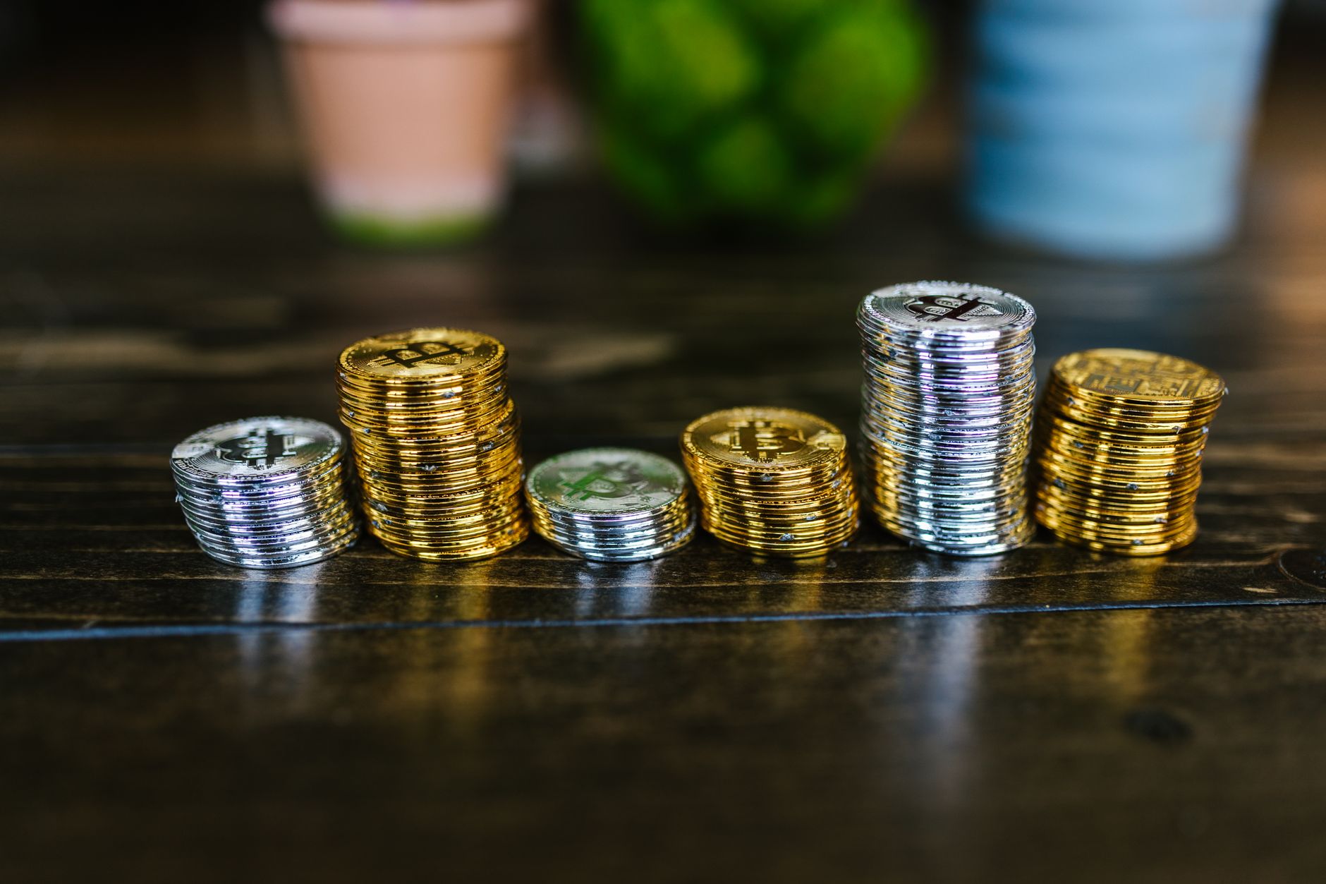 Silver coins and bullion bars stacked as a physical investment portfolio