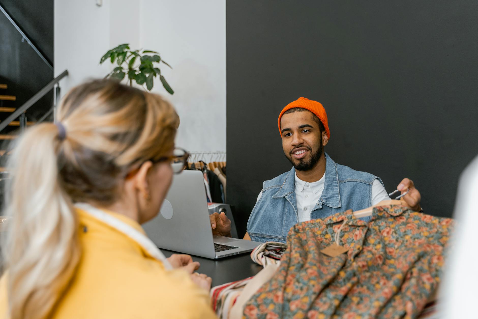 Small business owner working at a desk reviewing customer data