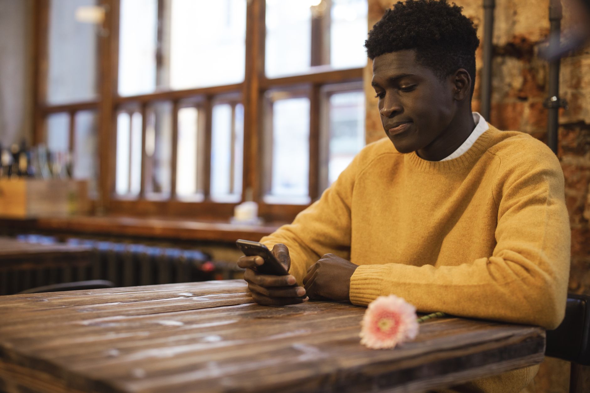 Customer reading business answers on his phone while deciding which local company to call