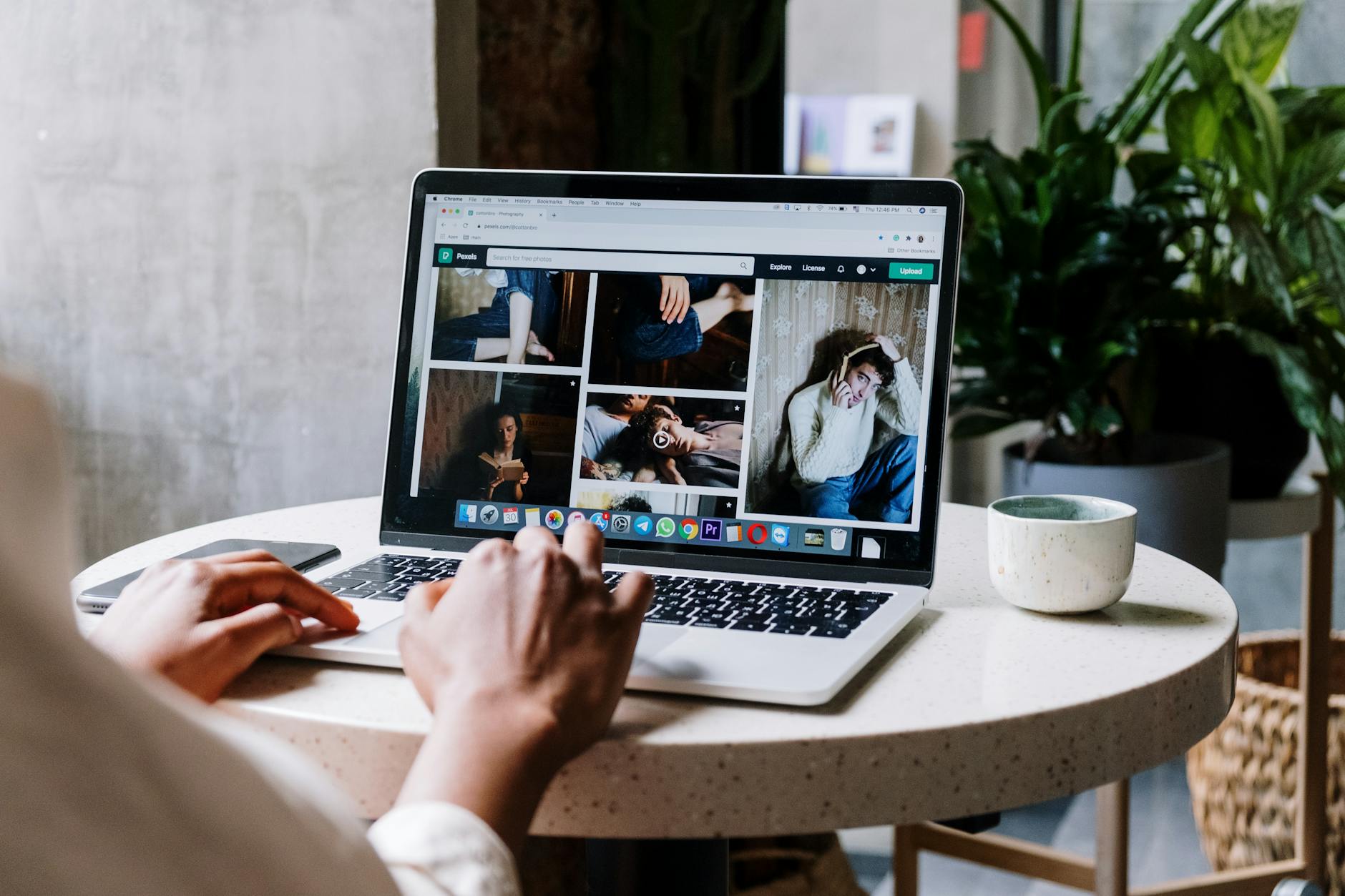 Business owner reviewing their website on a laptop at a desk