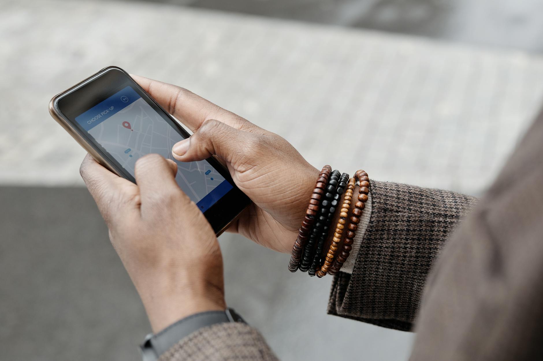 Person using a smartphone to search for a local business on Google Maps