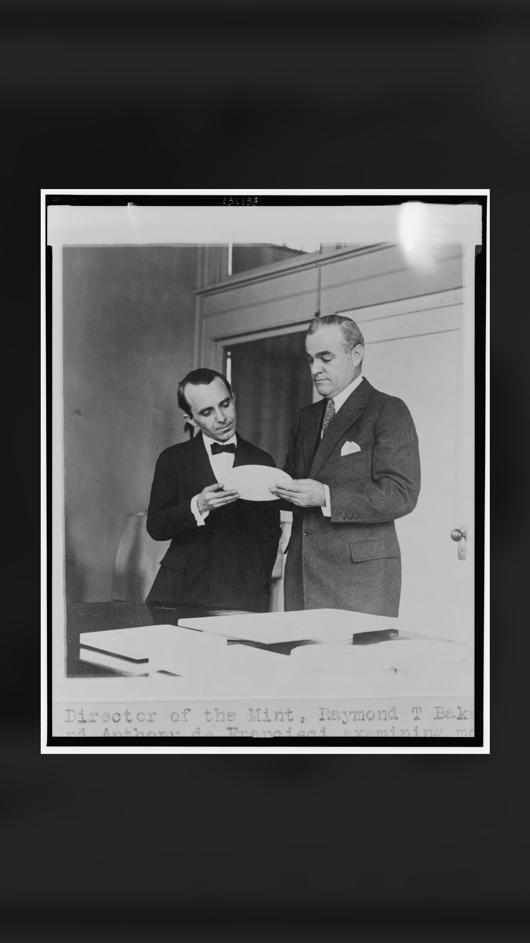 Raymond T. Baker and Anthony de Francisci examining the new silver dollar model. Library of Congress.