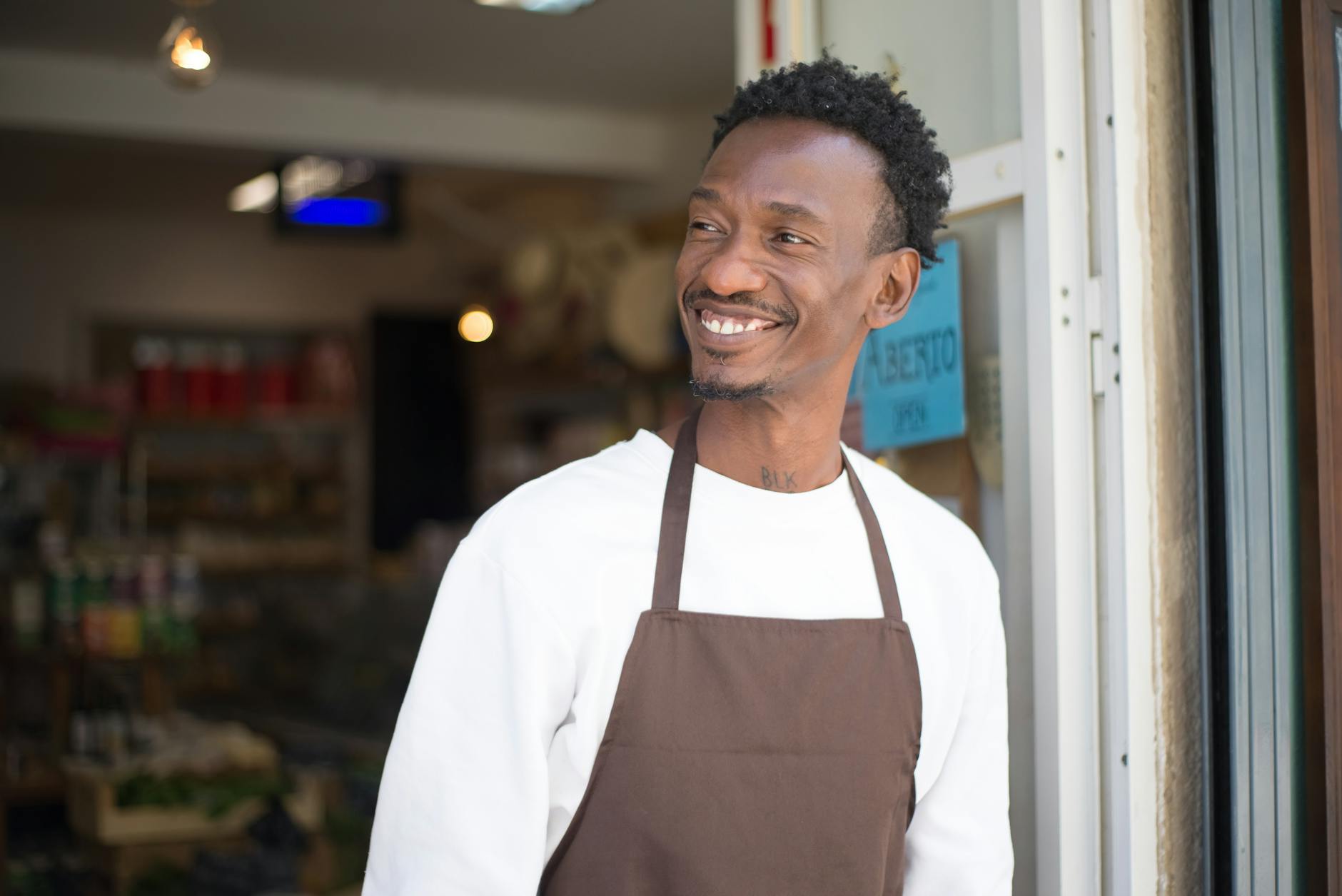 Small business storefront with customer walking in
