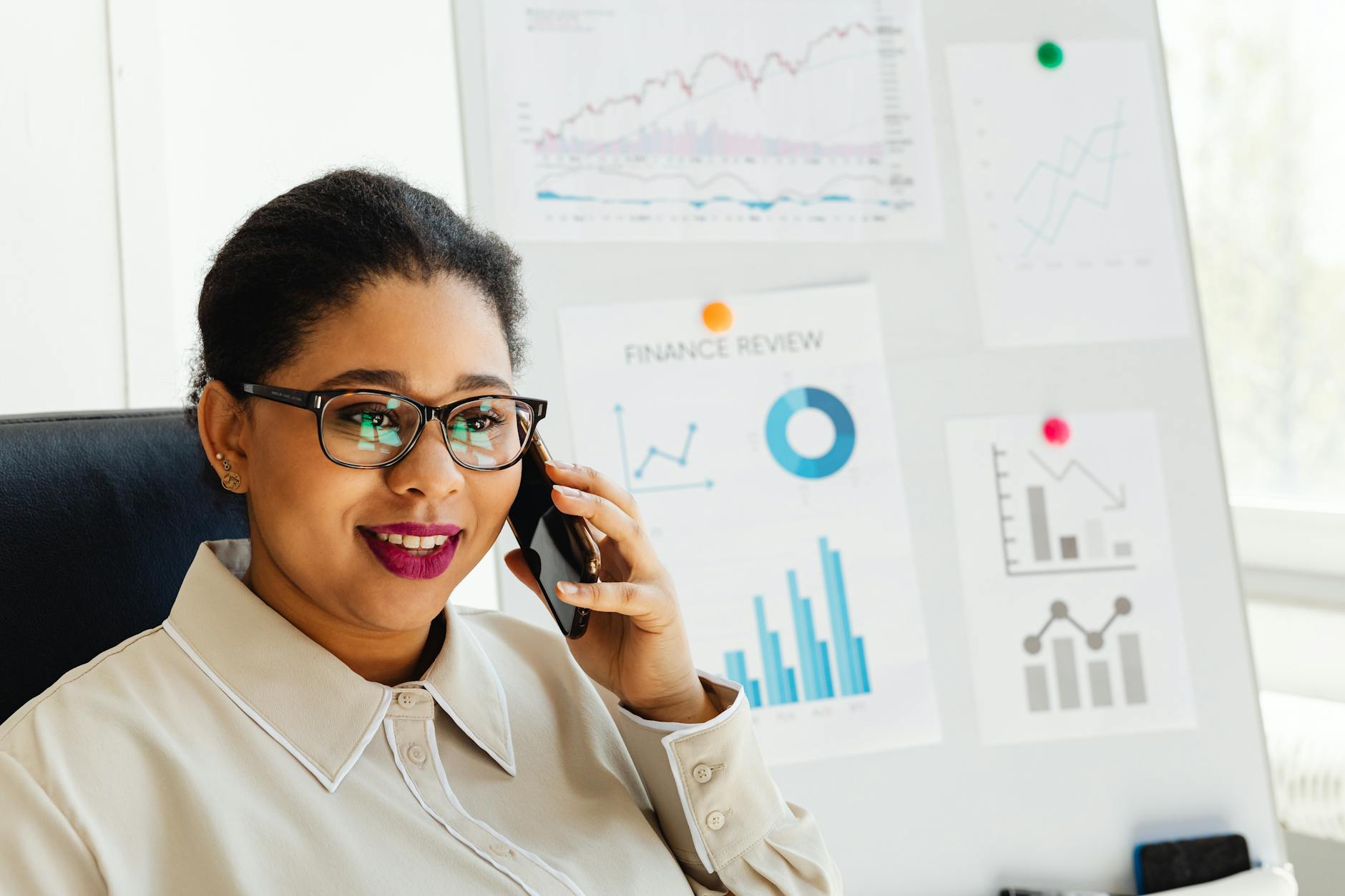 Small business owner at counter setting up text message marketing system