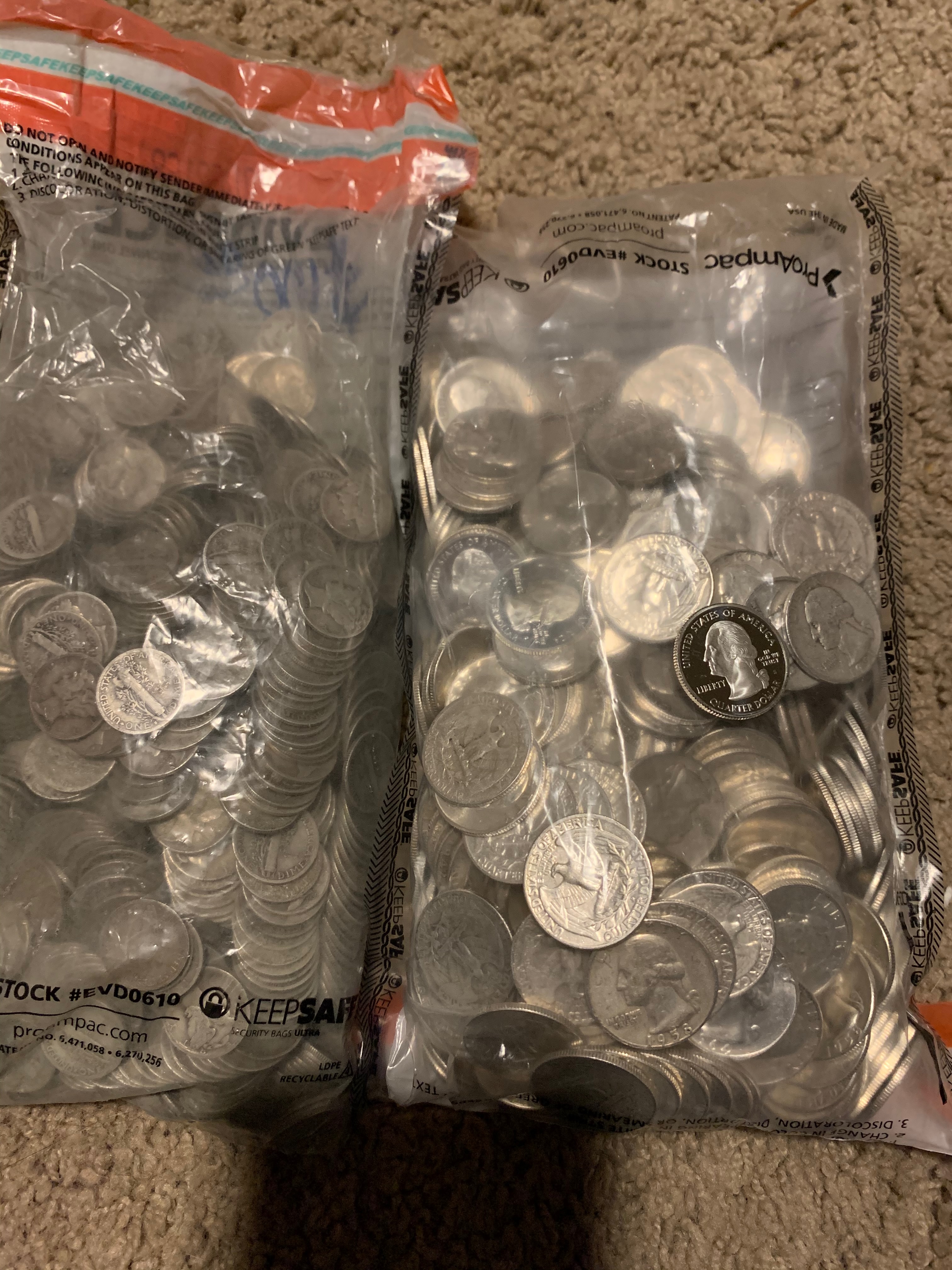Two bags of 90% silver US coins including quarters and dimes